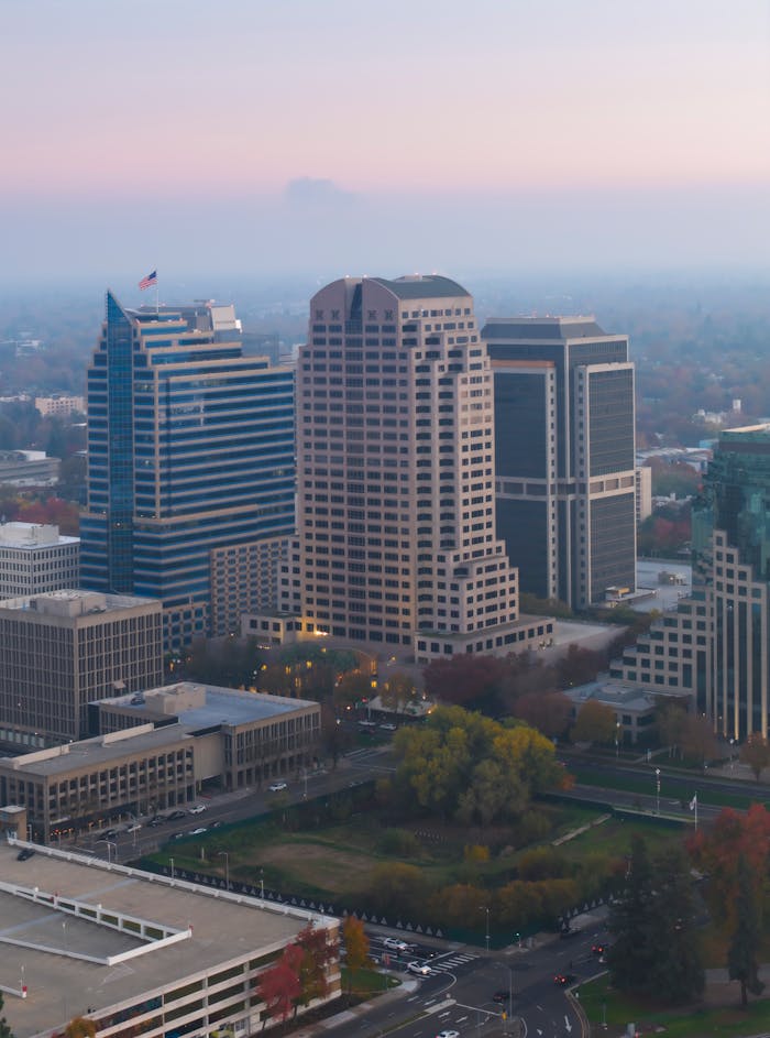 Stunning aerial view of Sacramento's skyline with modern skyscrapers at dusk, showcasing the city's urban landscape.